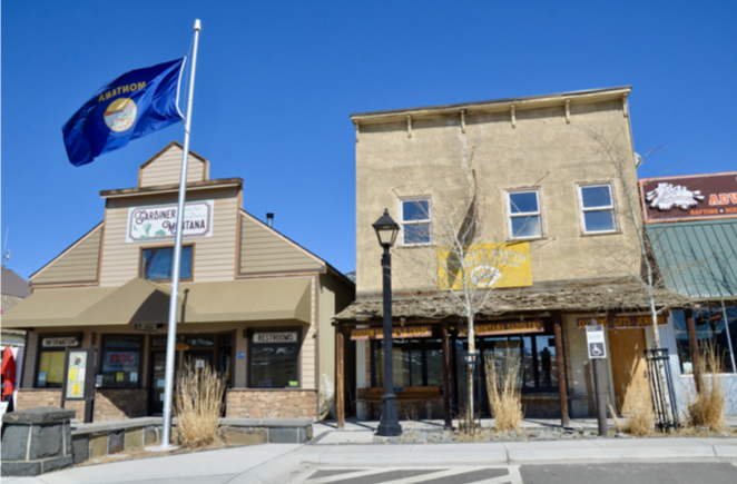 Montana state flag flying outside the Gardiner visitor building