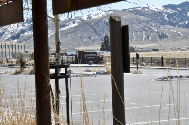 Yellowstone National Park entrance area framed by timber posts